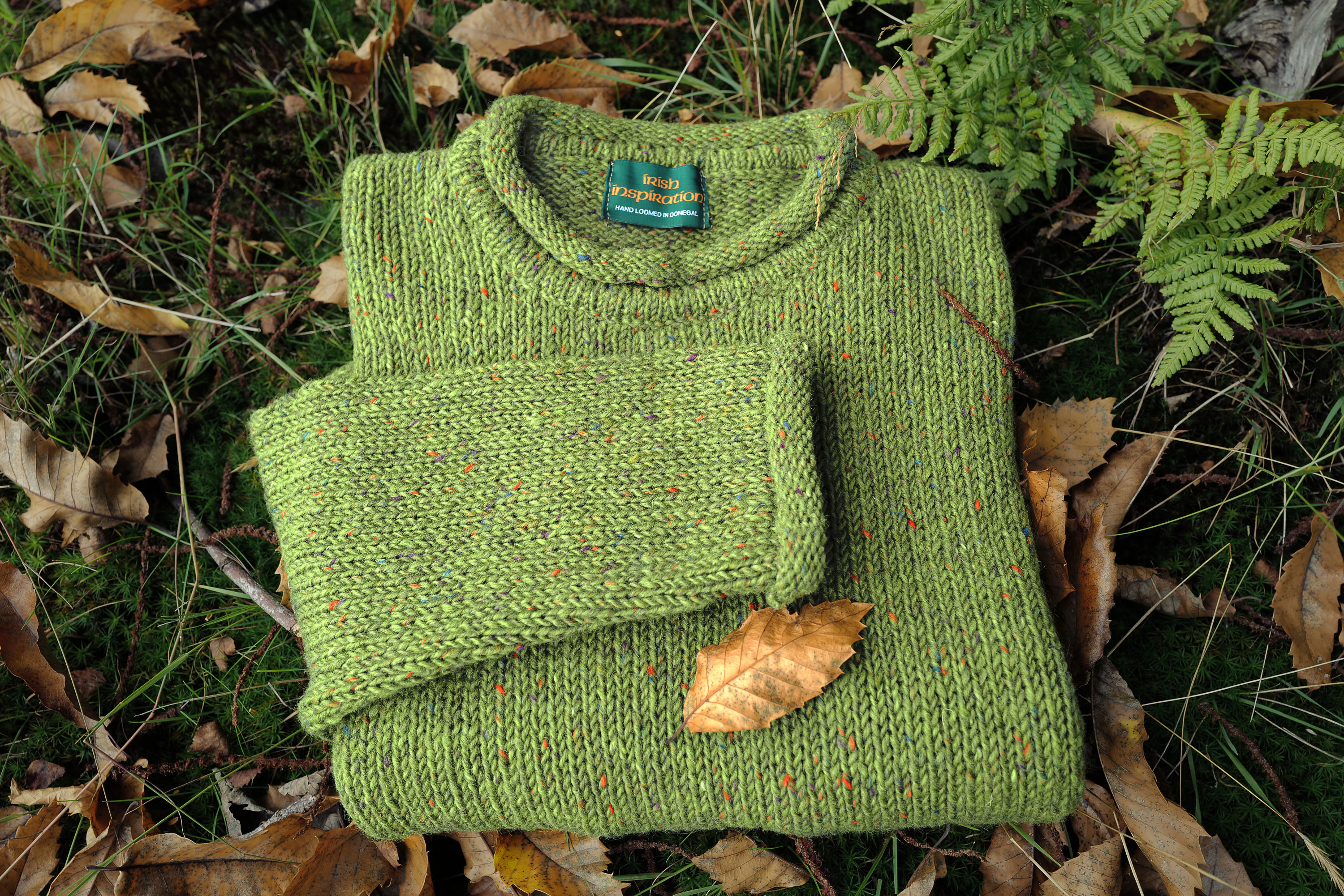 Bright green hand loomed sweater in Donegal tweed yarn from Irish